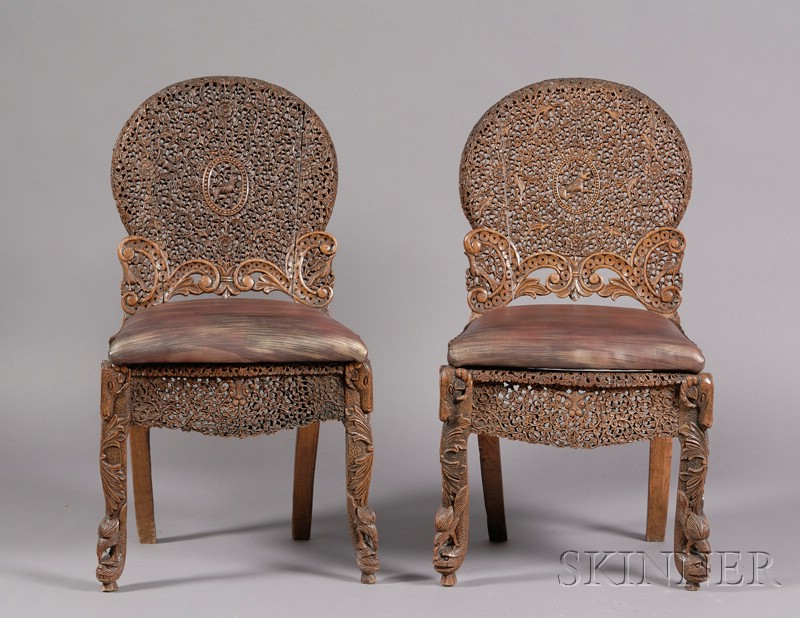 Appraisal: Pair of Anglo-Indian Chairs th century ornately carved and pierced