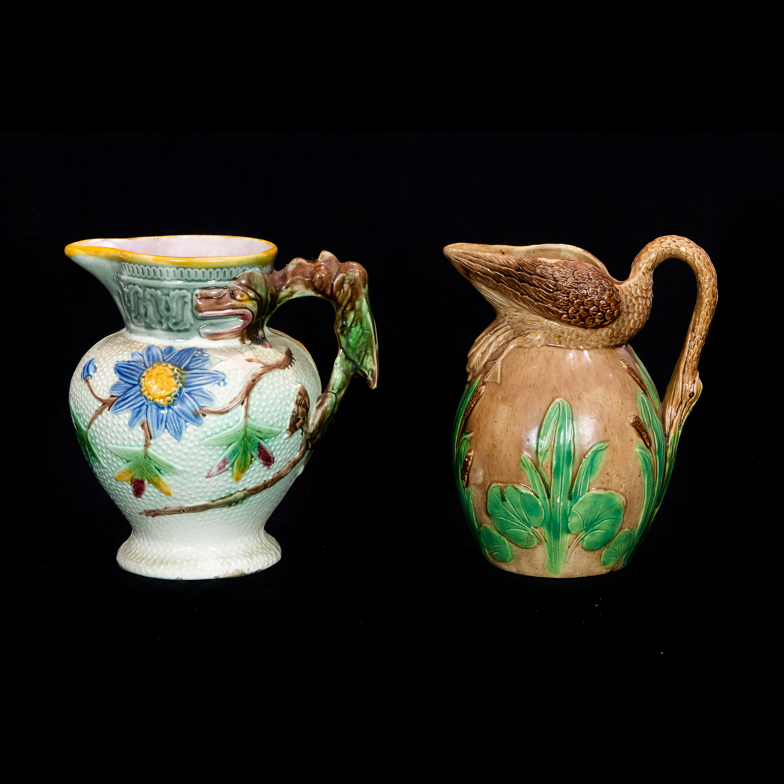 Appraisal: LOT OF MAJOLICA PITCHERS Lot of Majolica pitchers one with