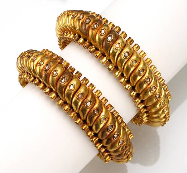 Appraisal: Two diamond and eighteen karat gold plate bangle bracelets gross