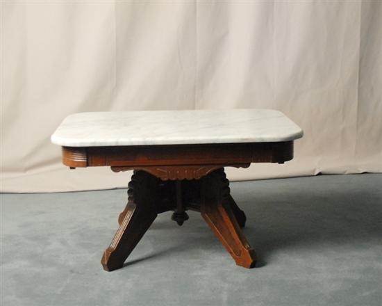 Appraisal: An Eastlake Victorian Walnut Marble-top Coffee Table the top white