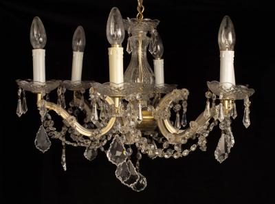 Appraisal: A six-light chandelier with baluster central column and scroll arms