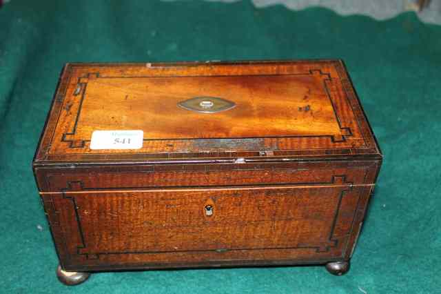 Appraisal: A GEORGE IV MAHOGANY TEA CADDY with ebony stringing and