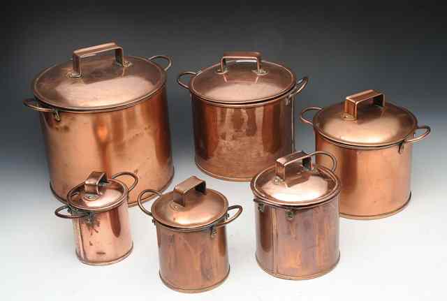 Appraisal: A GRADUATED SET OF SIX CYLINDRICAL COPPER POTS AND LIDS