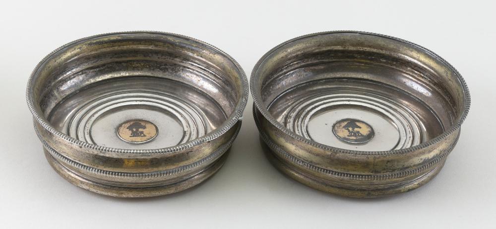 Appraisal: PAIR OF SILVER PLATED WINE BOTTLE COASTERS ENGLAND EARLY TH