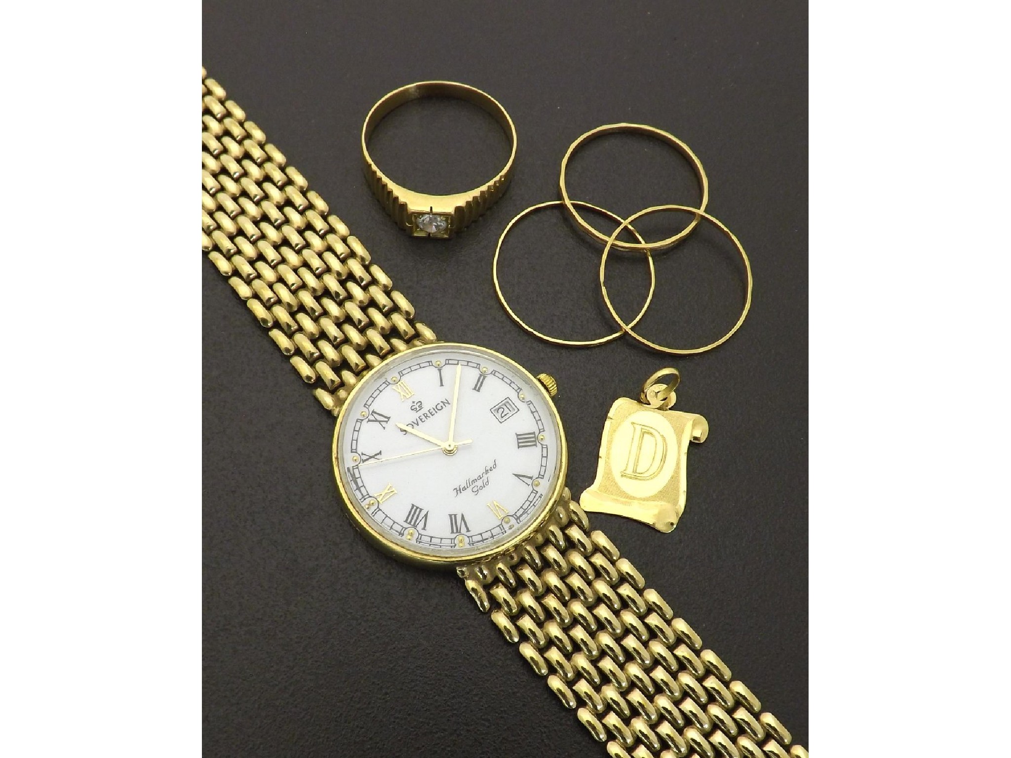 Appraisal: Gentleman's Sovereign ct bracelet watch together with four gold rings