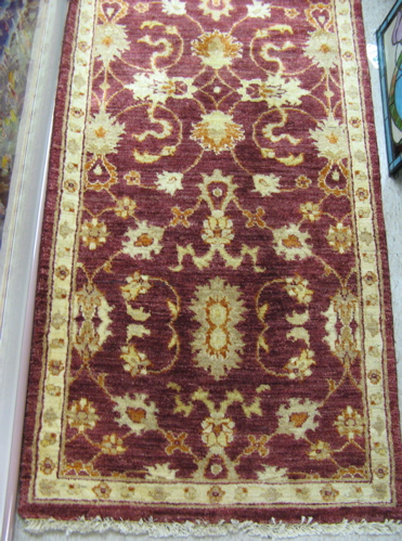 Appraisal: HAND KNOTTED ORIENTAL RUNNER Pakistani Persian overall scrolling floral raceme