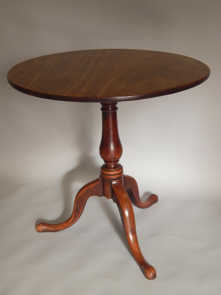 Appraisal: A George III mahogany tilt top table the circular top