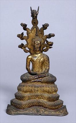 Appraisal: SOUTH EAST ASIAN FIGURE OF BUDDHA Modeled seated against a