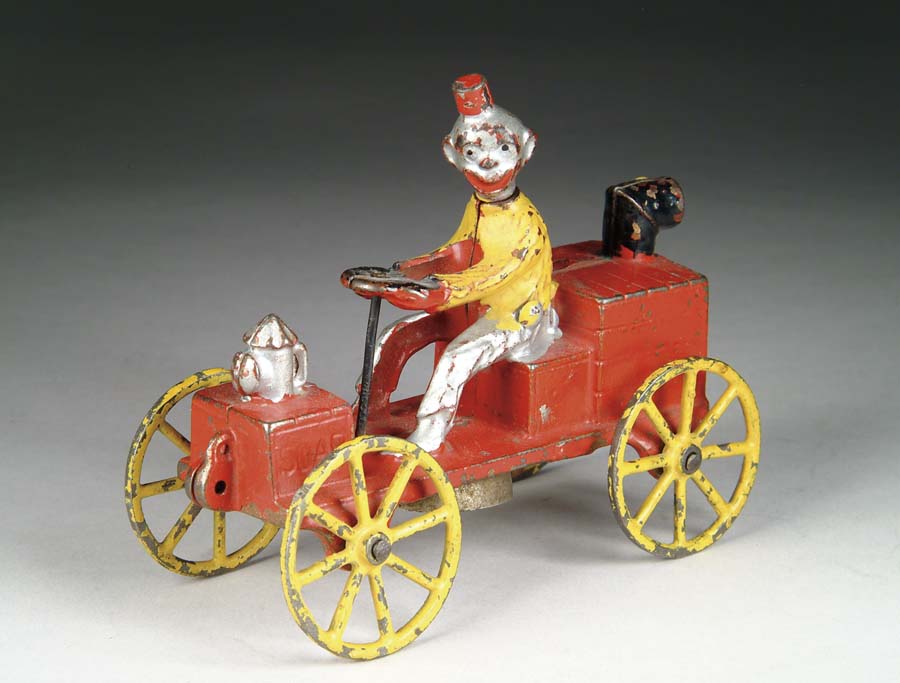 Appraisal: HAPPY HOOLIGAN AUTOMOBILE BELL TOY Manufactured by N N Hill