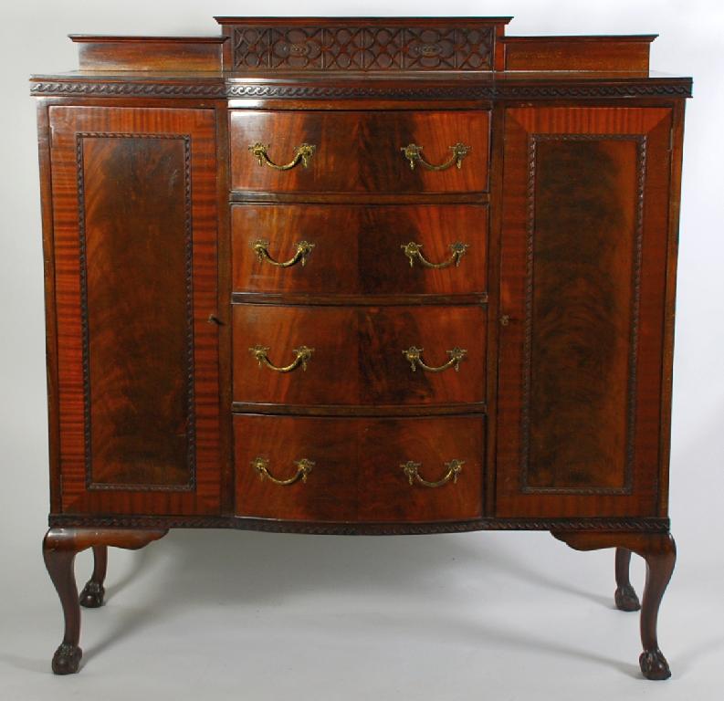 Appraisal: EARLY TWENTIETH CENTURY MAHOGANY SIDE CABINET the bow fronted top