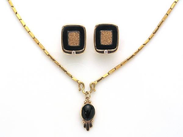 Appraisal: A black onyx and k gold pendant together with a