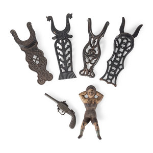 Appraisal: Six Cast Iron Boot Jackets th Century including a pistol-form