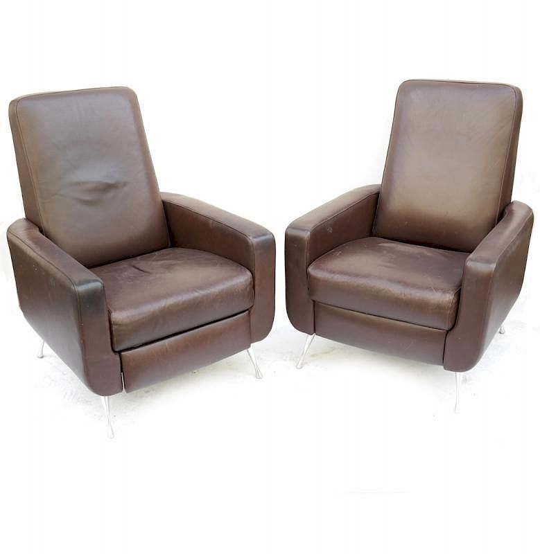 Appraisal: Pair of Leather Reclining Armchairs Pair of leather reclining armchairs