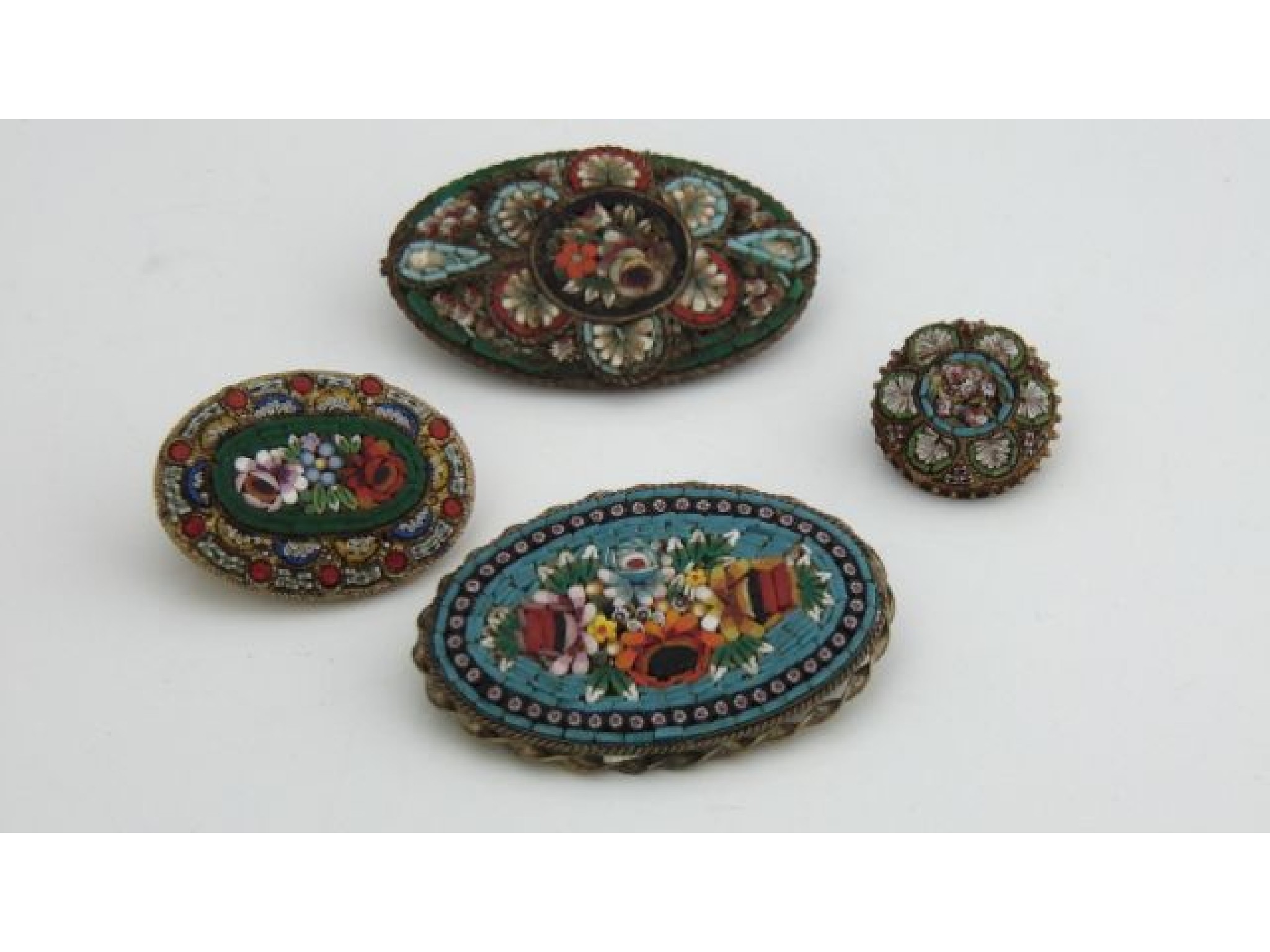 Appraisal: A collection of four various micro mosaic brooches each centred