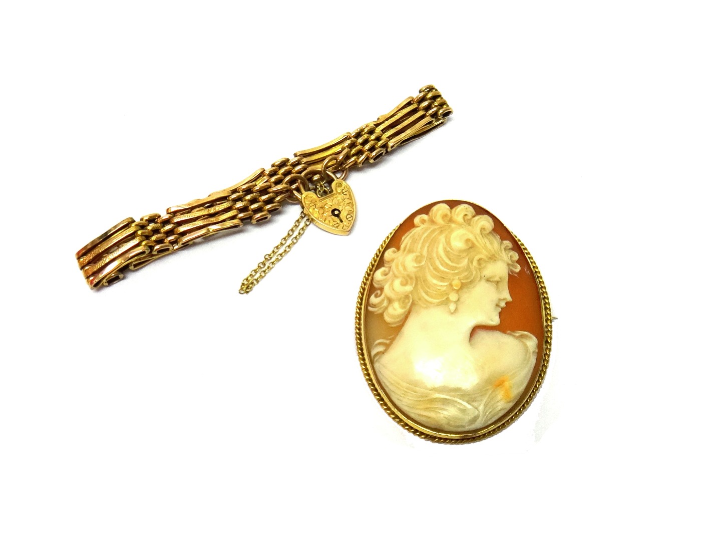 Appraisal: A gold mounted oval shell cameo brooch carved as the