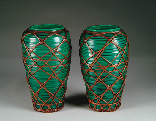 Appraisal: PAIR OF ORIENTAL JAPANESE GREEN POTTERY VASES WITH BASKET COVERING