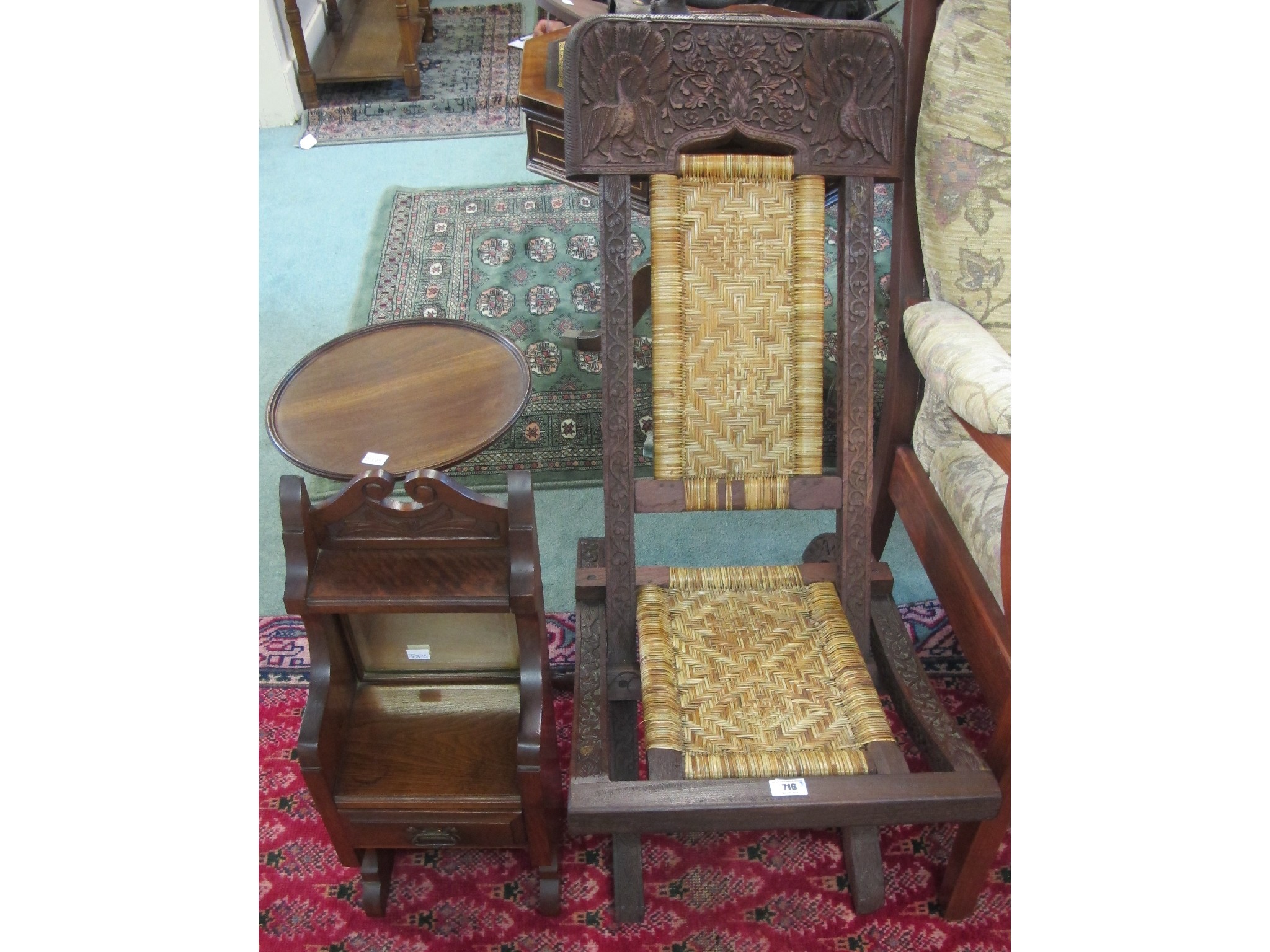 Appraisal: A carved hardwood folding chair with rush seat an oak