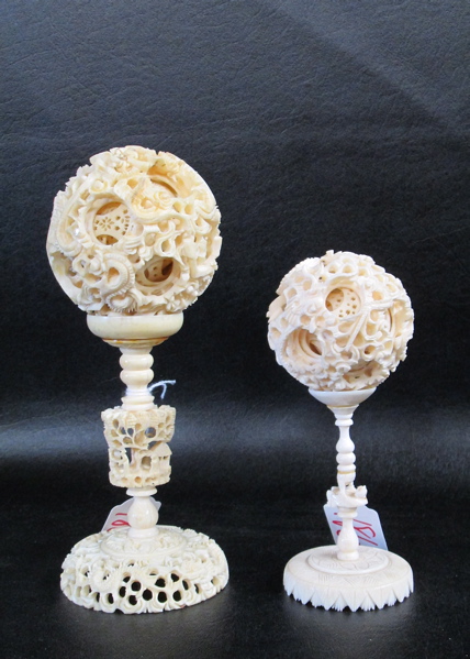 Appraisal: IVORY BALLS OF MYSTERY AND STANDS two each having multi-layers