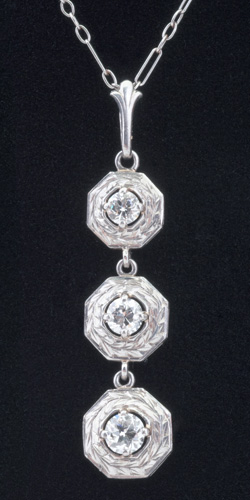 Appraisal: Art Deco three-stone diamond pendant in k wg Three graduated