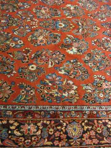 Appraisal: Sarouk Persian Handmade Room Size Rug elaborate florals on red