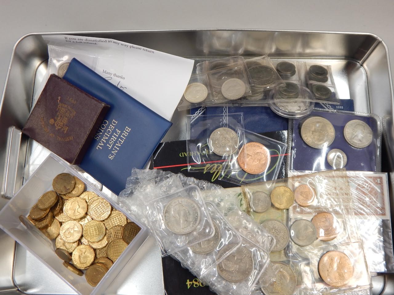 Appraisal: A quantity of British coins to include brass thre-penny bits