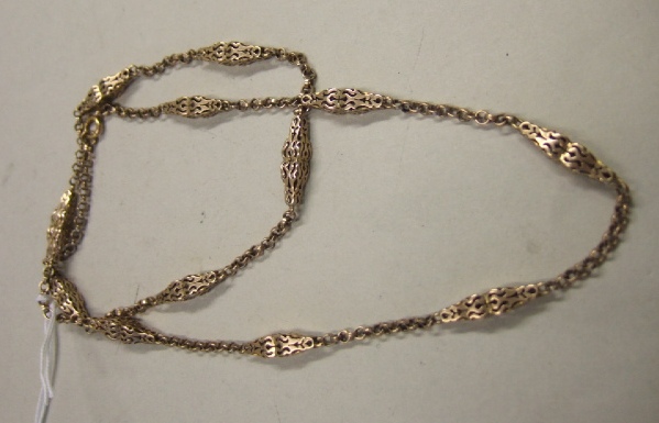 Appraisal: A gold neckchain in a circular link design with scroll