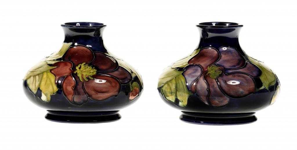 Appraisal: TWO MOORCROFT CLEMATIS VASES DESIGNED BY WALTER MOORCROFT cm h