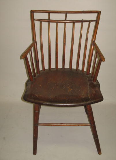 Appraisal: BIRDCAGE WINDSOR ARMCHAIR Old dark finish mid th century Seven-spindled