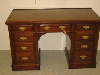 Appraisal: A VICTORIAN WALNUT PEDESTAL DESK the moulded edged top with