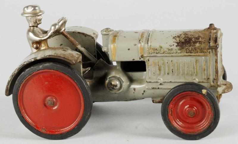 Appraisal: Cast Iron Arcade Tractor Toy Description American Original nickel driver