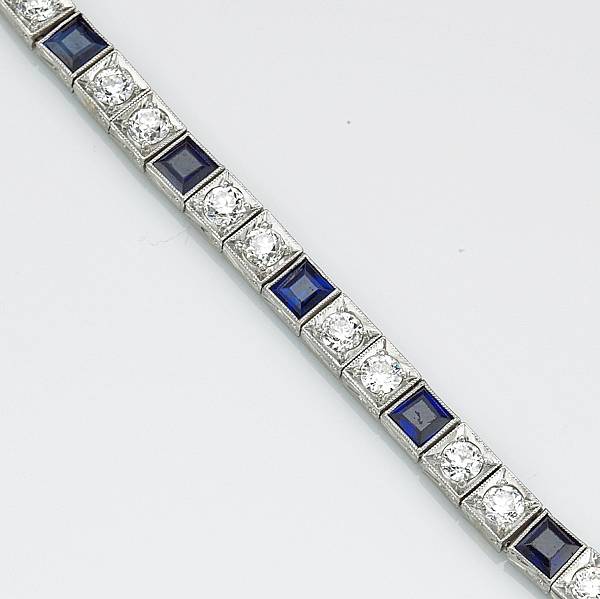 Appraisal: An art deco diamond synthetic sapphire and platinum line bracelet