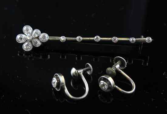 Appraisal: An Edwardian diamond set gold bar brooch with flowerhead terminal