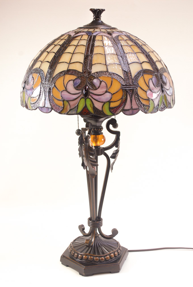 Appraisal: TIFFANY INSPIRED STAINED GLASS TABLE LAMP the shade having stylized