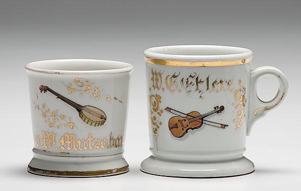 Appraisal: TWO MUSICIAN'S OCCUPATIONAL SHAVING MUGS porcelain mugs with polychrome painted