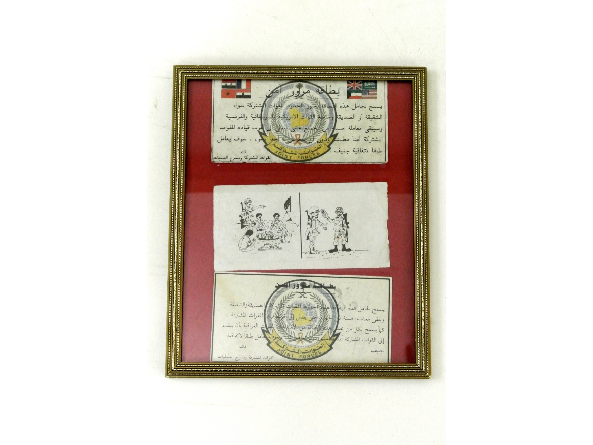 Appraisal: A framed montage of three Iraqi war propaganda leaflets produced