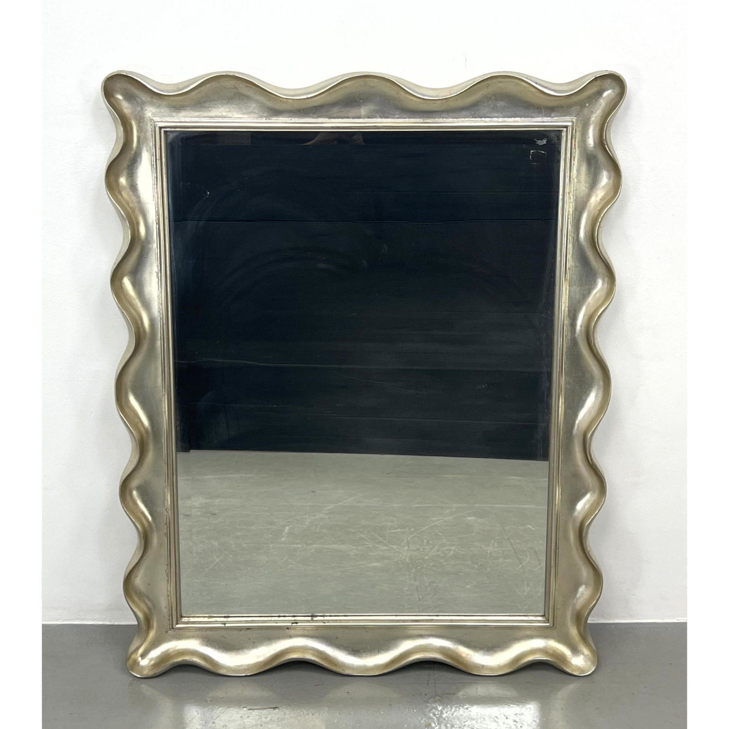 Appraisal: Silvered Finish Wavy Carved Wood Framed Mirror Silver gilt Oversized