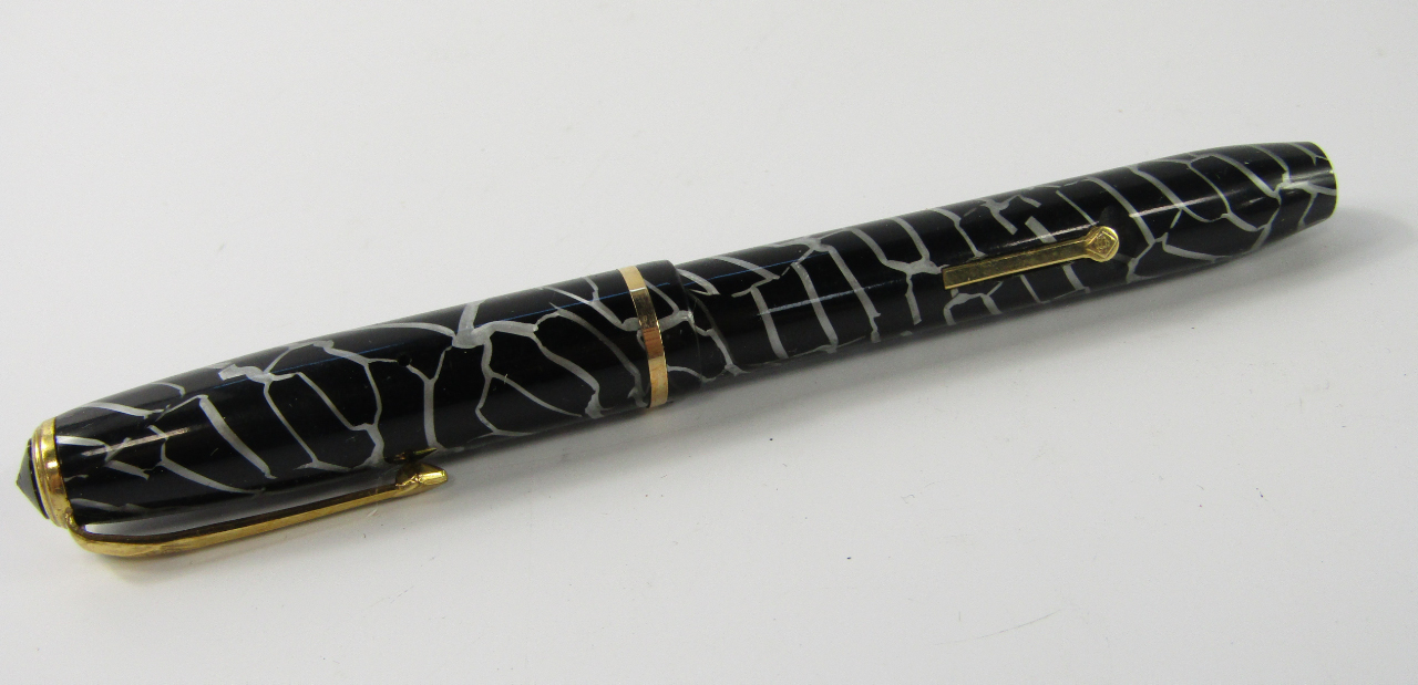 Appraisal: A Conway Stewart fountain pen with black cracked ice casing