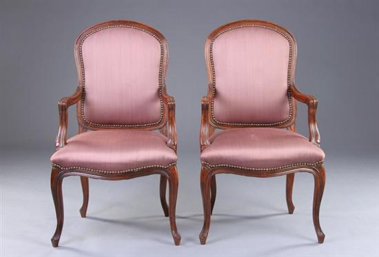 Appraisal: PAIR PROVINCIAL LOUIS XV STYLE FAUTEUILS th century Molded-edge frame