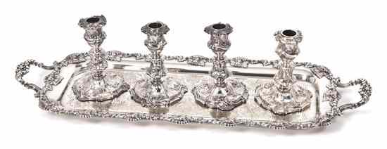 Appraisal: A Set of Four Rococo Style Silverplate Candlesticks having floral