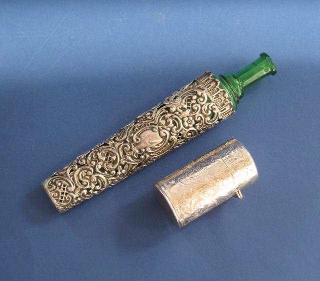 Appraisal: AN EDWARDIAN GREEN GLASS SCENT BOTTLE AND HOLDER of tapering