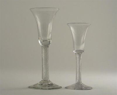 Appraisal: Two wine glasses with trumpet bowls and air twist stems