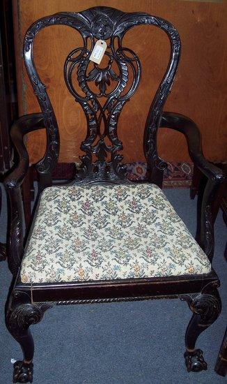 Appraisal: An th Century style open armchair with intricately carved and