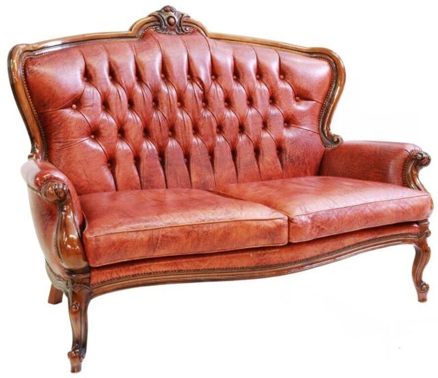 Appraisal: Italian wingback leather sofa th c carved crest over button-tufted