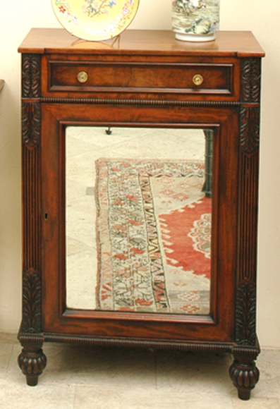 Appraisal: A LATE REGENCY MAHOGANY SIDE CABINET The reverse breakfront rectangular