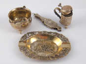 Appraisal: A pair of continental silver chatelaine lorgnettes a silver ashtray