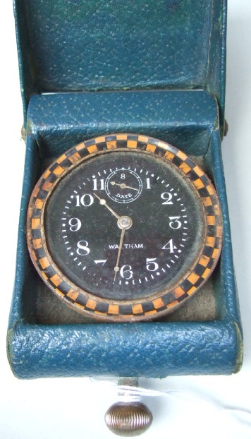 Appraisal: A gilt metal cased Waltham clock the signed black dial