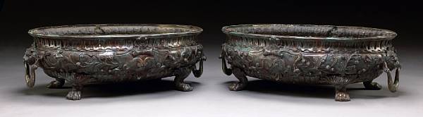 Appraisal: A pair of Neoclassical style patinated bronze jardini res th