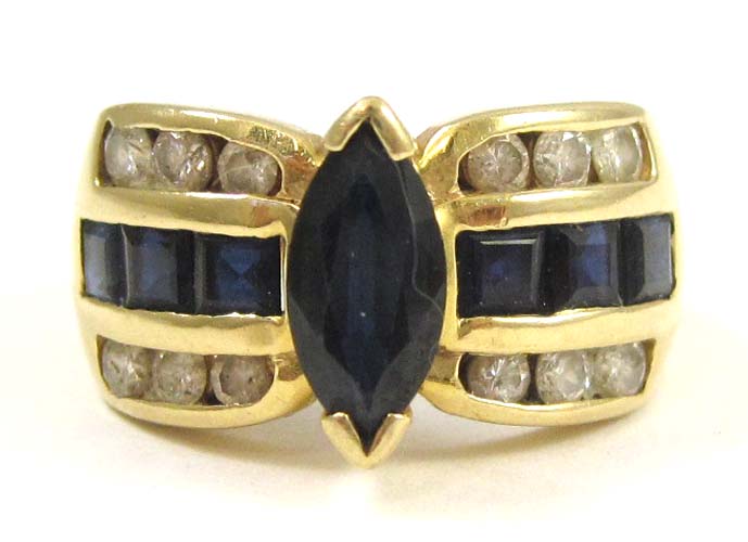 Appraisal: SAPPHIRE DIAMOND AND FOURTEEN KARAT GOLD RING centering a marquise-cut