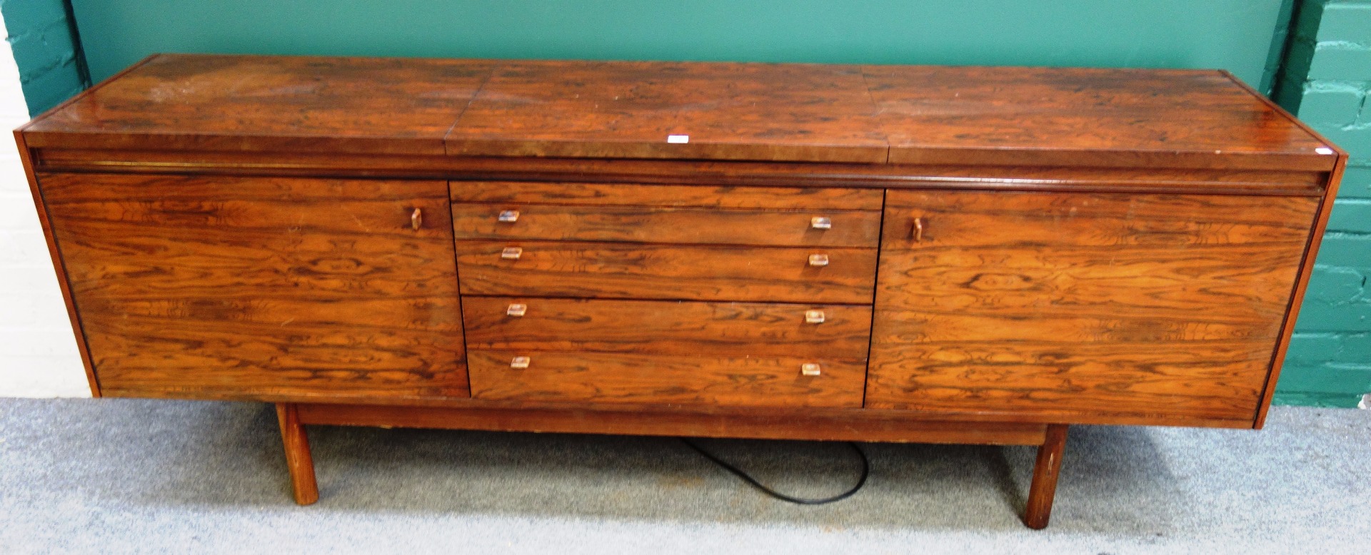 Appraisal: Probably Archie Shine a mid- th century rosewood sideboard with