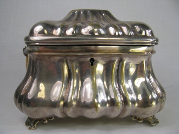 Appraisal: Silver plated footed chest with attached lift lid and AS